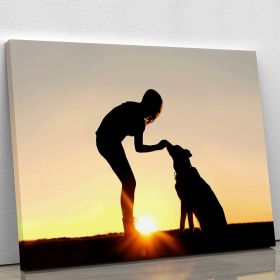 A silhouette of a girl sitting outside in the grass with her pet German Shepherd Mix Dog feeding him treats during training in front of a sunsetting s (type: Standard Framed Canvas Print, size: 60" x 40" / 150cm x 100cm (approx))